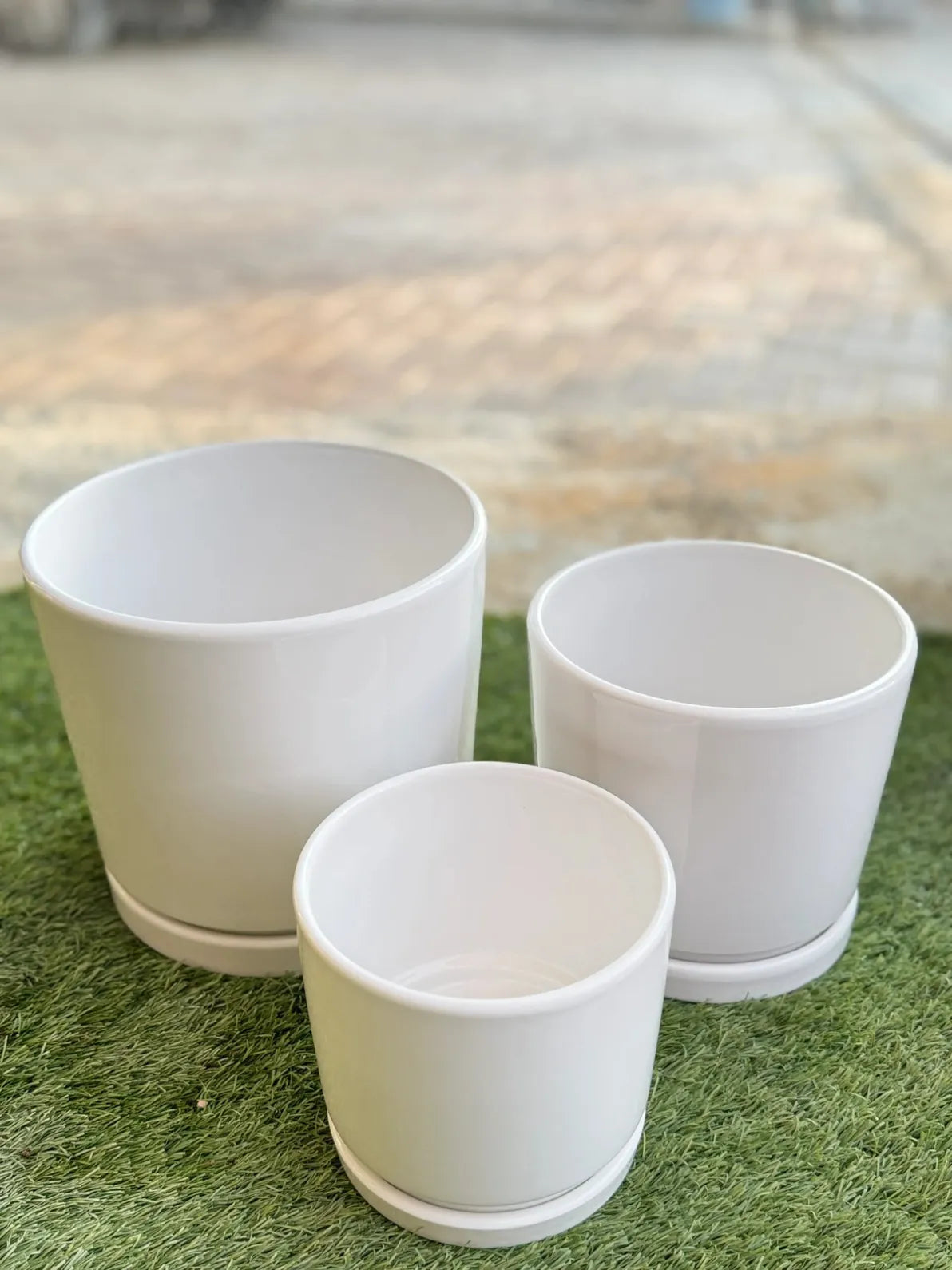 Durable white ceramic pot set for plant styling, perfect for succulents, small trees, and timeless home décor in the UAE.